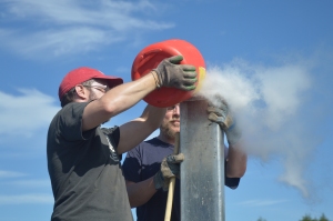 Jack Williams and Jason McLachlan filling the core casing with ethanol so that the cold slurry conducts to the outer wall.